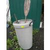 Image 1 : RUBBERMAID GARBAGE CAN W/MISC. PADDLE, PRUNERS, ETC.