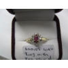 Image 3 : LADIES 10KT RING W/RED STONE & SM. DIAMONDS SZ 7 1/2
