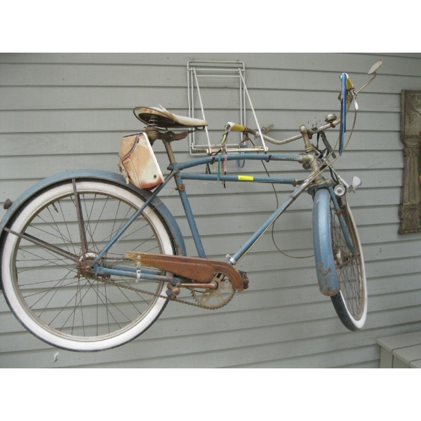 VINTAGE BICYCLE HANGING ON WALL