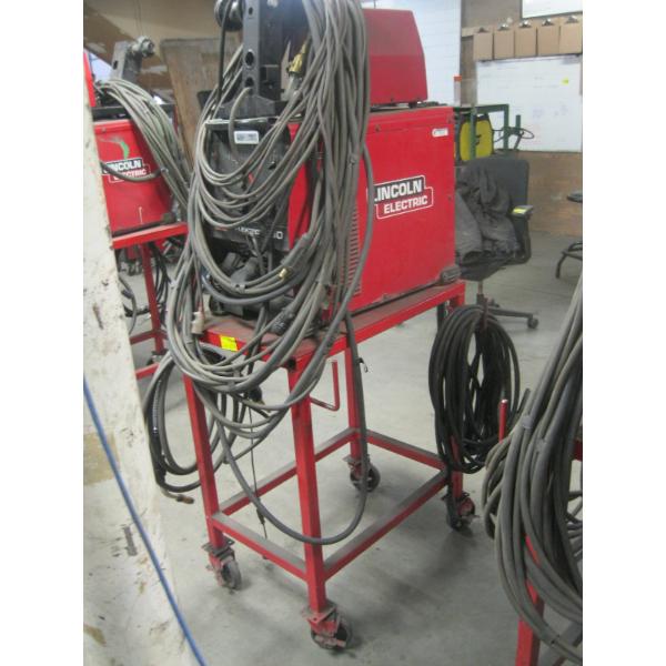 LINCOLN FLEX TECH 650 WELDER W/LINCOLN LF74 WIRE FEED ON CART W/ACCESS.