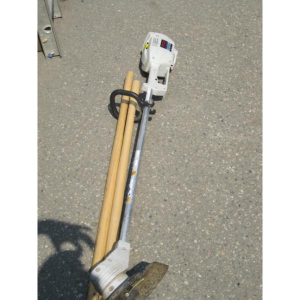 RYOBI WEED WACKER & 2 NEW SHOVEL HANDLES