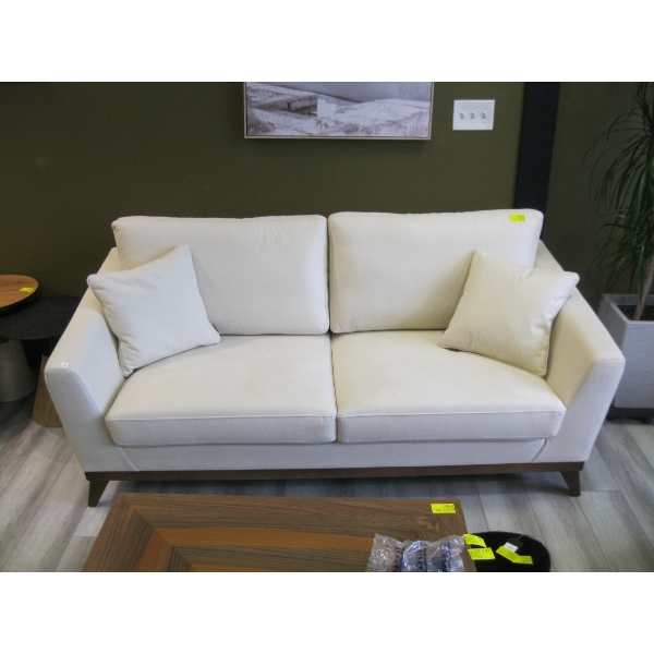 LIGHT COLORED SOFA W/CUSHIONS
