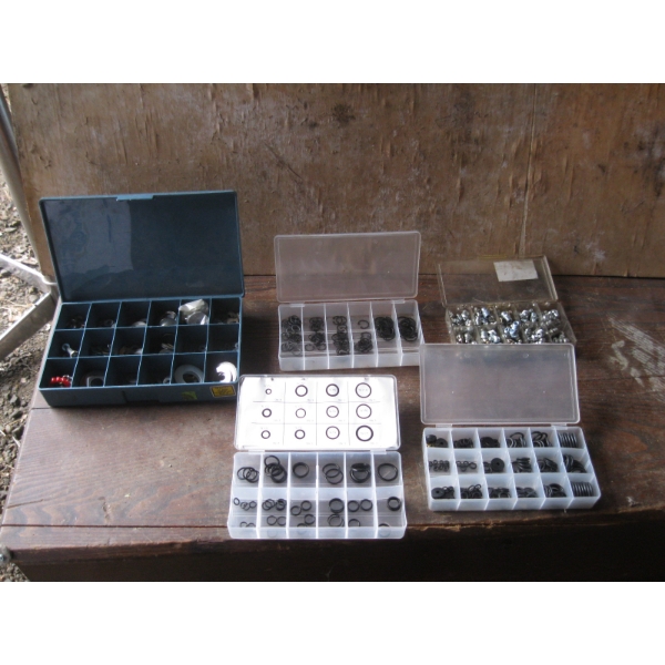4 CONTAINERS W/CONTENTS - GREASE NIPPLES, O RING SETS, MISC. WASHERS, ETC.