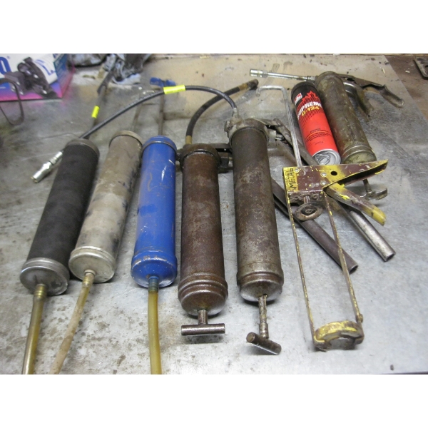 LOT OF GREASE GUNS, FLUID SUCTION CONTAINERS, ETC.