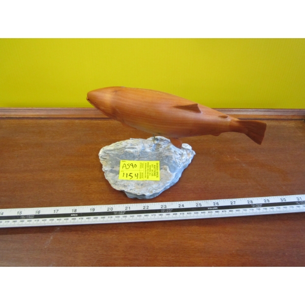 CARVED WOODEN FISH ON ROCK STAND