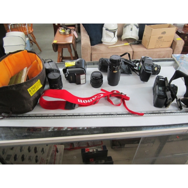 2 CANON T70 35MM CAMERAS W/ASST. LENSES, FLASH, ETC.