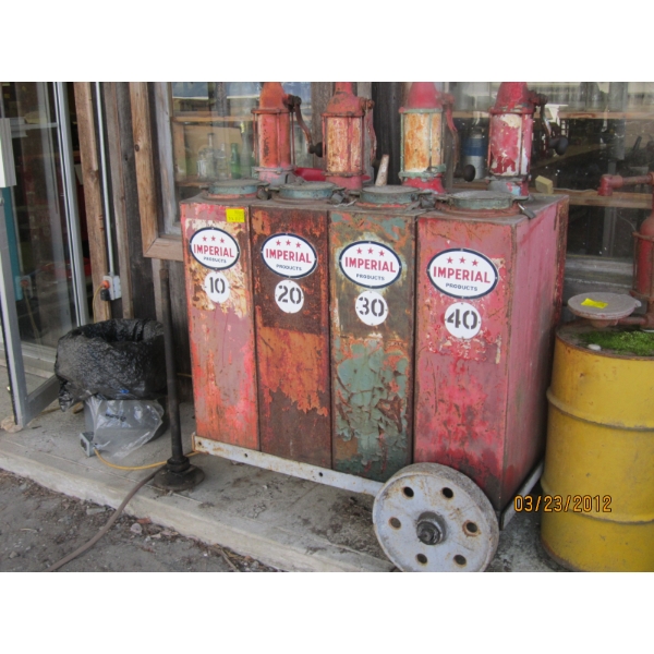 3 OIL PUMPS W/TANKS & SIGNS ON CART
