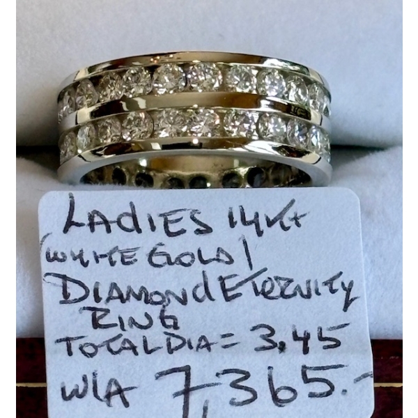 LADIES 14KT WHITE GOLD DIAMOND ETERNITY RING, W/A $7,365, SZ 7.5