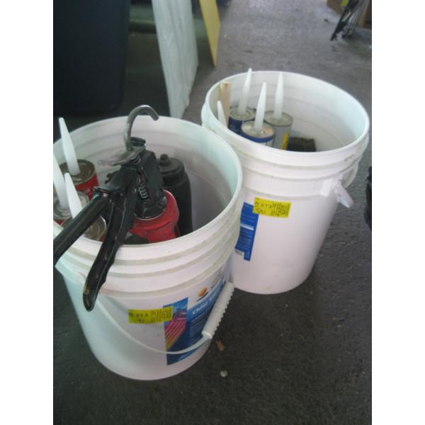 2 PAILS OF CAULKING, CAULKING GUN, ETC.