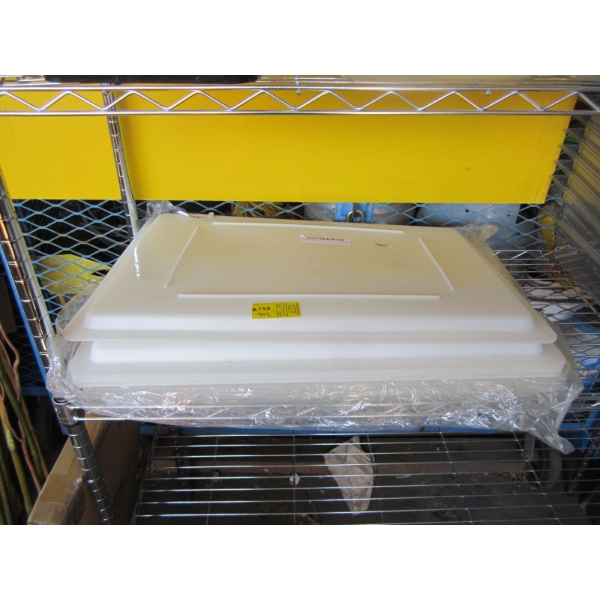 STACK OF PLASTIC FOOD BIN LIDS