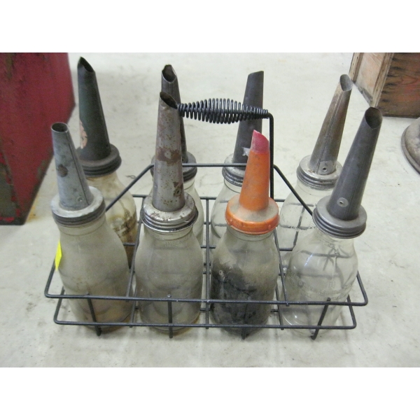 6 GLASS OIL BOTTLES IN CRATE