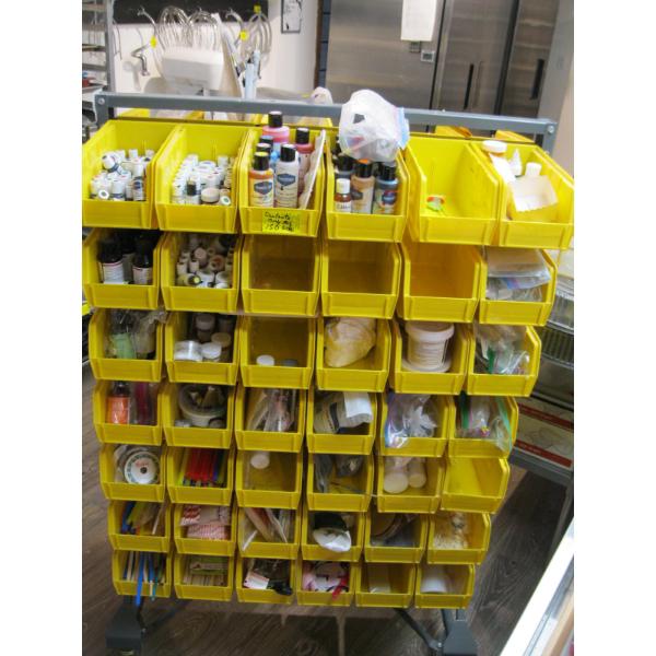CONTENTS OF ONE SIDE OF  YELLOW STORAGE BIN UNIT - CONTENTS ONLY