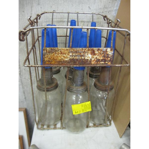 9 GLASS OIL BOTTLES IN CRATE