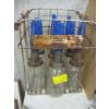 Image 1 : 9 GLASS OIL BOTTLES IN CRATE