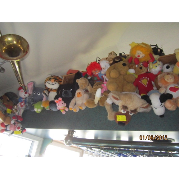 LG. LOT OF STUFFED ANIMALS ABOVE THE BAR