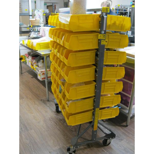 STORAGE BIN UNIT ON CASTORS WITH YELLOW  STORAGE BINS - NO CONTENTS