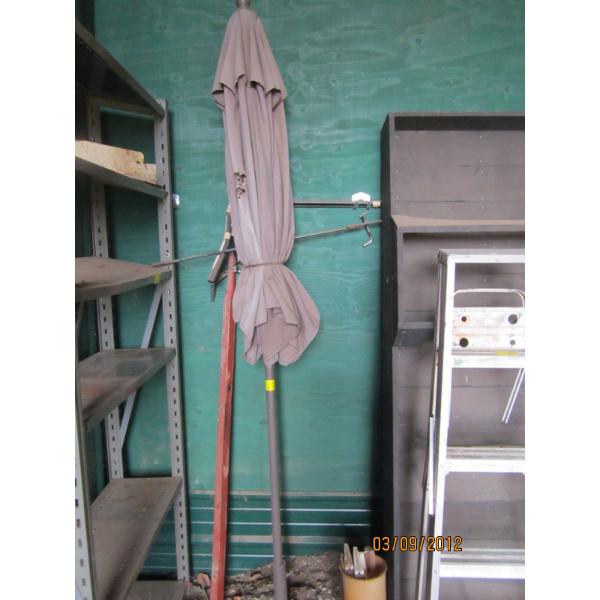 PATIO UMBRELLA - NEEDS SOME REPAIR