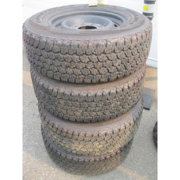 SET OF 4 GOODYEAR WRANGLER TIRES ON 8 BOLT RIMS - LT265/70R18