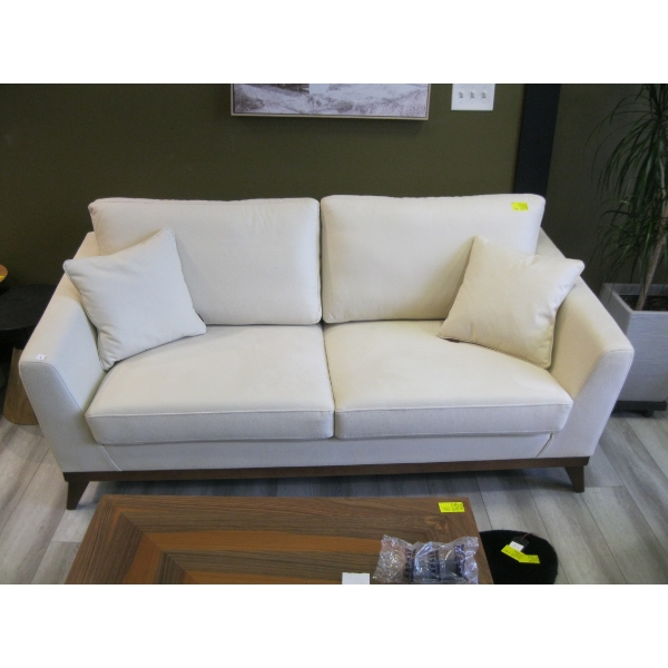 LIGHT COLORED SOFA W/CUSHIONS