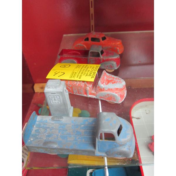 4 TRUCKS (TOOTSIE TOY)  & A GAS PUMP