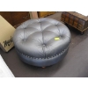 Image 1 : ROUND GREY LEATHER OTTOMAN