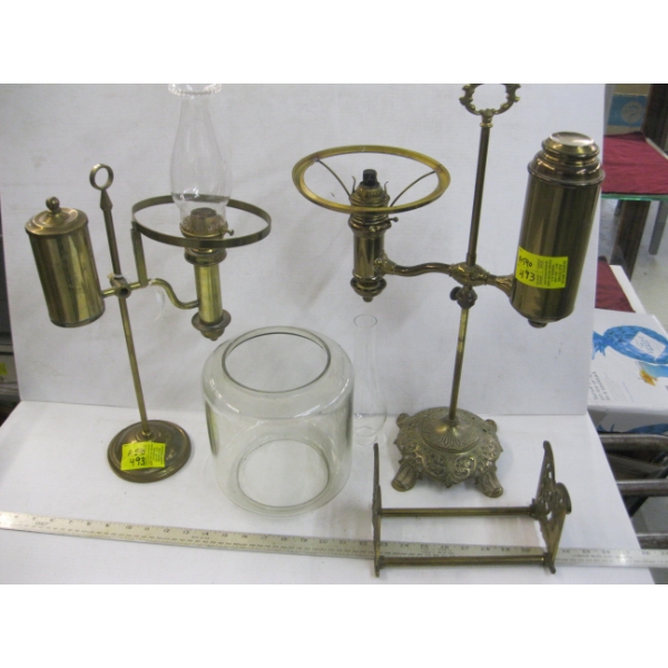 2 BRASS VINTAGE OIL LANTERNS & A BRASS BOOK HOLDER, ETC.