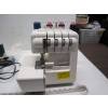 Image 5 : SERGER SEWING MACHINE & BAG OF ACCESS.