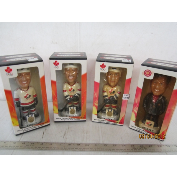 4 BOBBLE HEAD FIGURINES