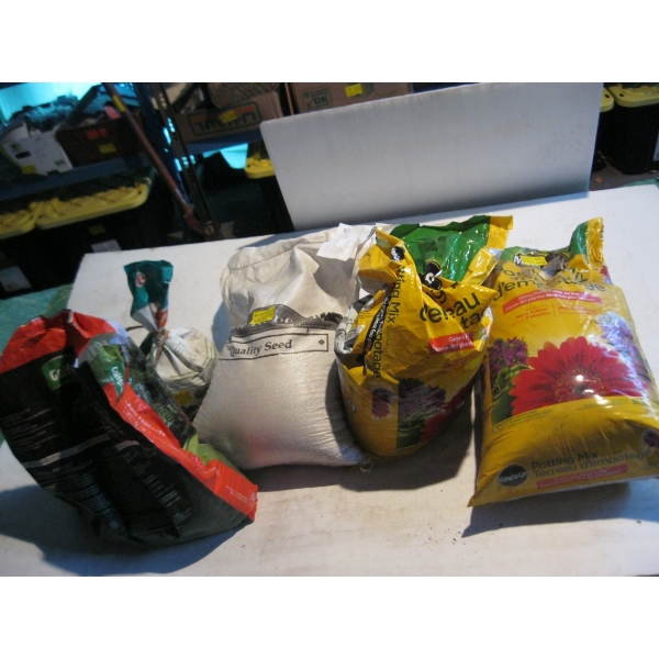 NEW BAG OF GRASS SEED FOR PASTURE & MISC. POTTING SOIL, FERTILIZER, ETC.