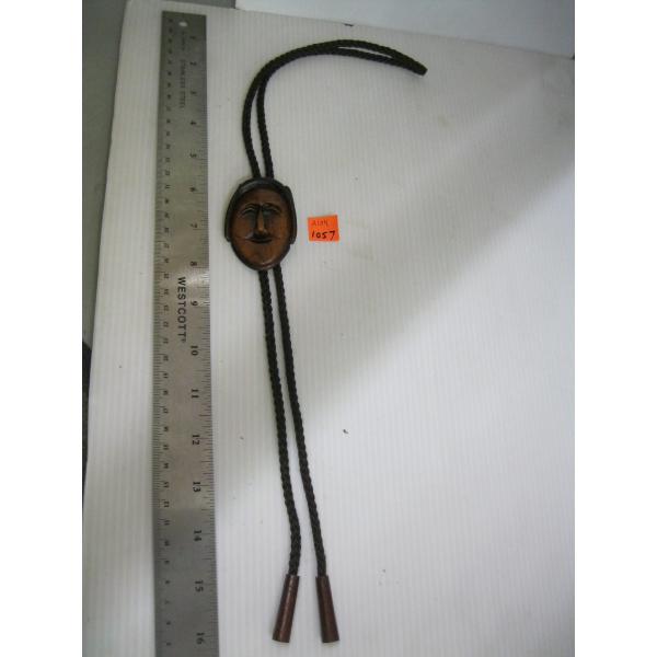 CARVED WOOD FACED BOLO TIE