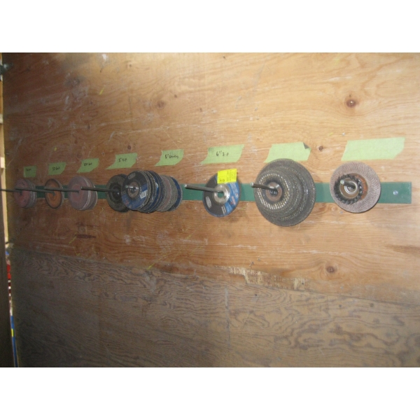 ASST. CUTTING & GRINDING DISCS ON WALL W/RACK