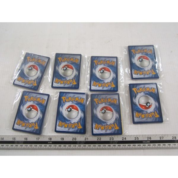 8 PACKS OF POKEMAN HOLO CARDS
