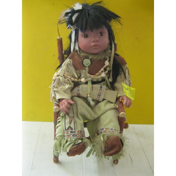 NATIVE FIGURINE IN CHAIR