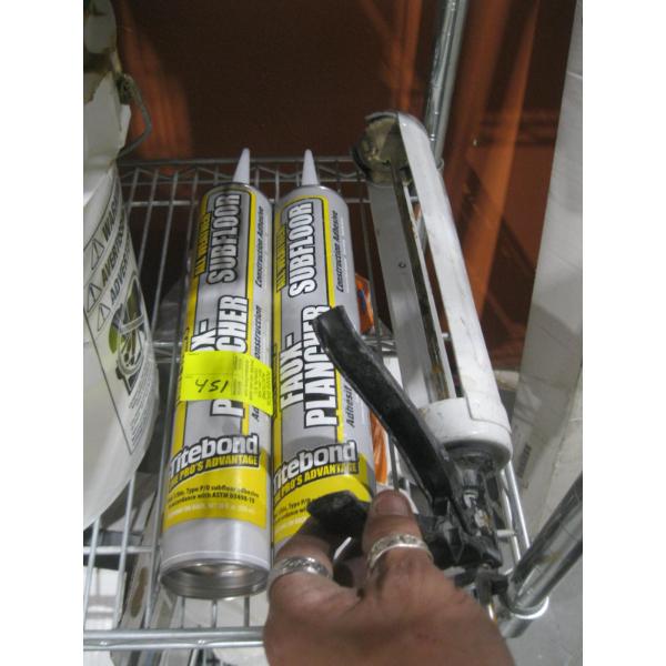 2 TUBES OF SUB FLOOR CONSTRUCTION ADHESIVE & A CAULKING GUN