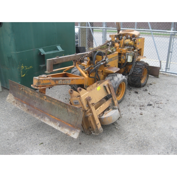 "AS IS" MINI CASE DAVIS TRACTOR W/BLADES & PIPE ATTACHMENT
