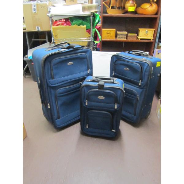 3 BLUE SUITCASES