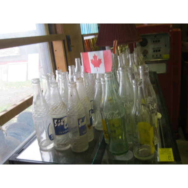 LG. SELECTION OF COKE BOTTLES, SUNCREST BOTTLES, SCHWEPPES, ETC.