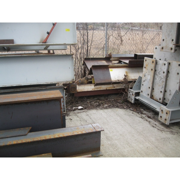LG. IBEAM PIECES AGAINST FENCE