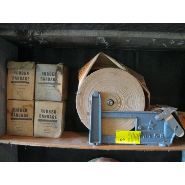 ROLL TAPE DISPENSER & 4 BOXES OF RUBBER??