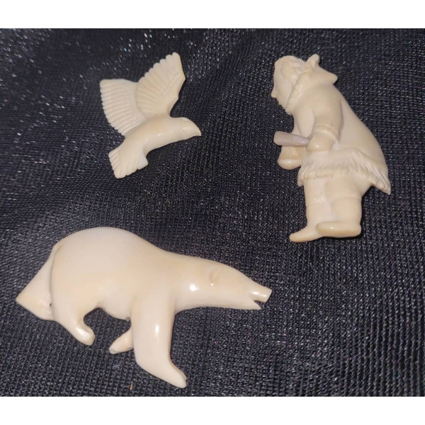 Three Hand-Carved Bone Pins Featuring Polar Bear, male figure, and Bird Designs