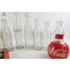 Image 5 : Coca-Cola Contour Designs From The 1940s And 1950s, Alongside Vintage Orange Crush Bottles.