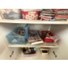 Image 3 :  cabinet full of quilting, supplies, a number of large rolls of thread, several zippers, and a numbe