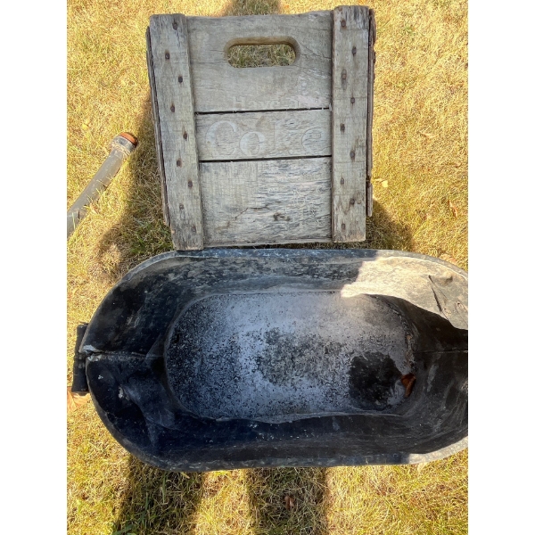 antique Coca-Cola box with antique boiler pot