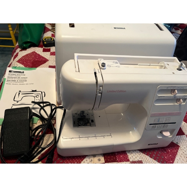 kenmore sewing machine with pedal and hard case model number 385. 16765
