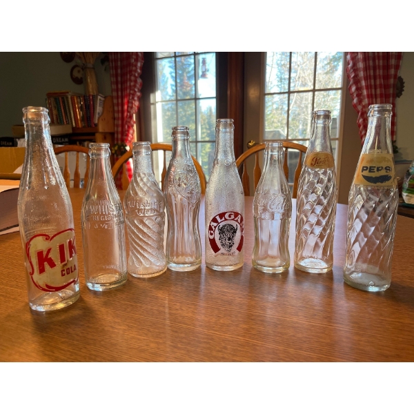 Atique clear soda bottles Coca-Cola wishing well whistle soda, Calgary soda and two Pepsi bottles al