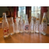 Image 1 : Atique clear soda bottles Coca-Cola wishing well whistle soda, Calgary soda and two Pepsi bottles al