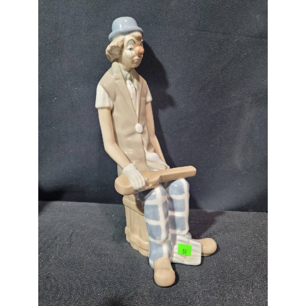 Porcelain Figurine of a Seated Clown with Banjo