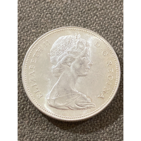 1965 Canadian Silver Dollar Coin Featuring Canoe Design