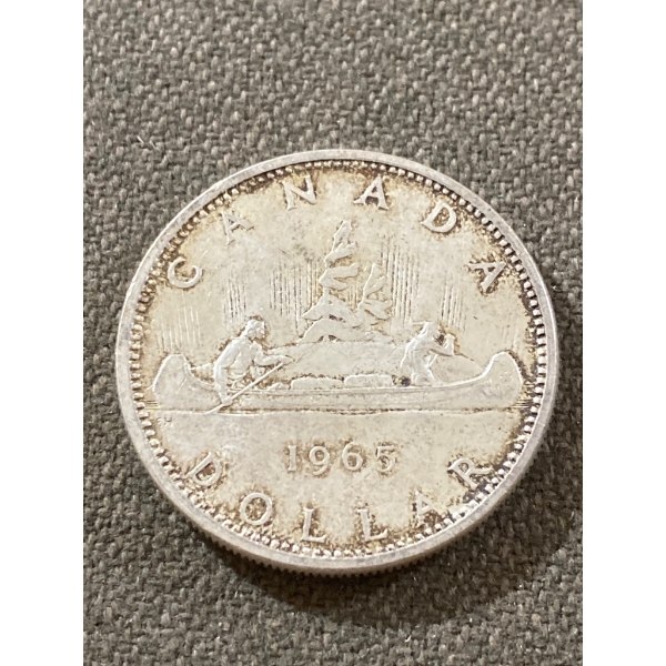 1965 Canadian Silver Dollar Featuring Canoe Design