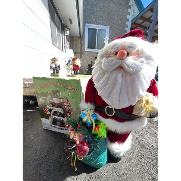 Santa statue 32” height with fiber, optic beard and lighted snowman with rotating train set
